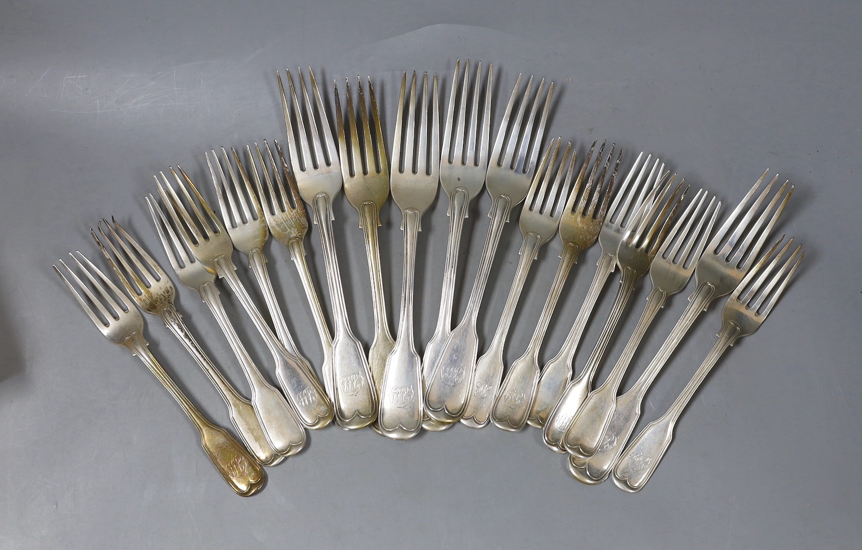 Twelve assorted 19th century silver fiddle and thread pattern dessert forks and six table forks, 36oz.